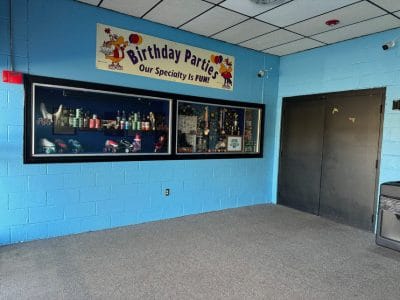 Interior entrance to Skateland showcasing skates for sale