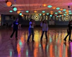 Teens roller skating at Skateland Hickory